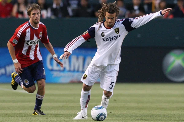 Kyle Beckerman controls and passes the ball while being pressured by Blair Gavin during the game — Stock Photo, Image
