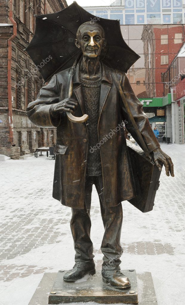 Monument of artist Andrew Pozdeev with umbrella in Krasnoyarsk