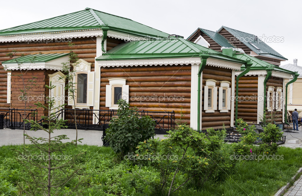 Wooden house with shutters and carving frames Irkutsk