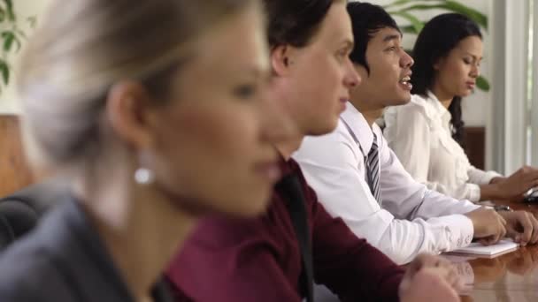 Happy beautiful caucasian business woman smiling during meeting with colleagues — Stock Video