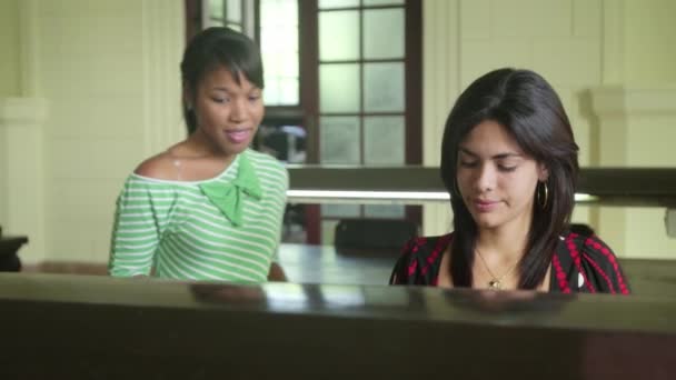 Group of happy students and friends in school library — Stock Video