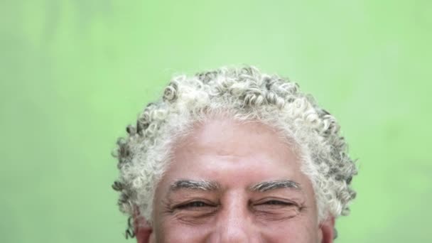 Portrait of happy mature hispanic man looking at camera, smiling — Stock Video