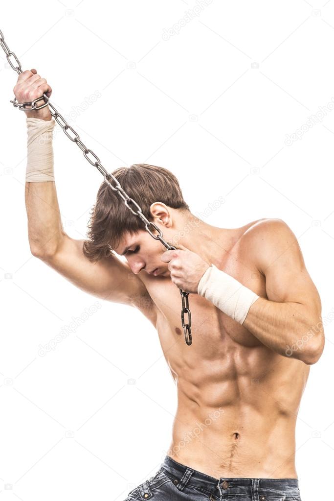 Image of muscle man posing in studio with chain
