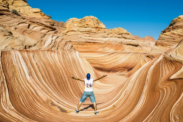 Young Man Jumping in desert Wave, Arizona