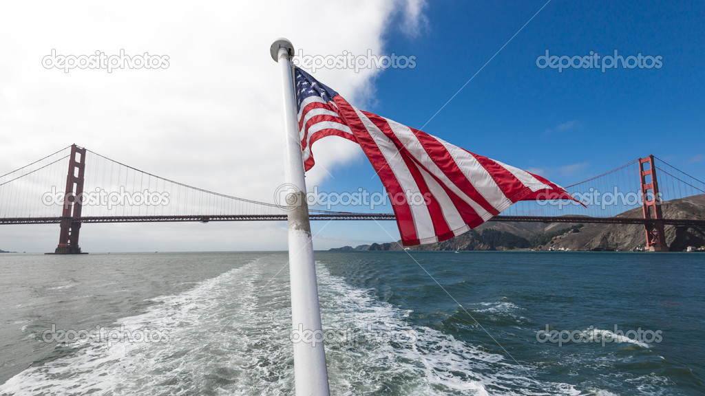 USA Flag in front of Golden gate Bridge