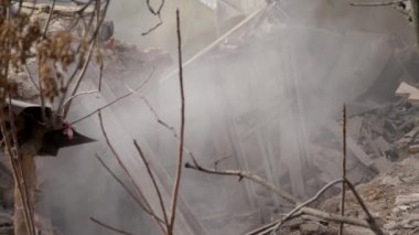 Ruined old brick house. Aftermath of the earthquake. Earthquake consequences concept. Broken wooden window in smoke of ruins. 4k high quality video