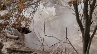 Ruined old brick house. Aftermath of the earthquake. Earthquake consequences concept. Broken wooden window in smoke of ruins. 4k high quality video