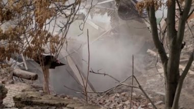 Ruined old brick house. Aftermath of the earthquake. Earthquake consequences concept. Broken wooden window in smoke of ruins. 4k high quality video