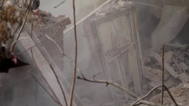 Ruined old brick house. Aftermath of the earthquake. Earthquake consequences concept. Broken wooden window in smoke of ruins. 4k high quality video