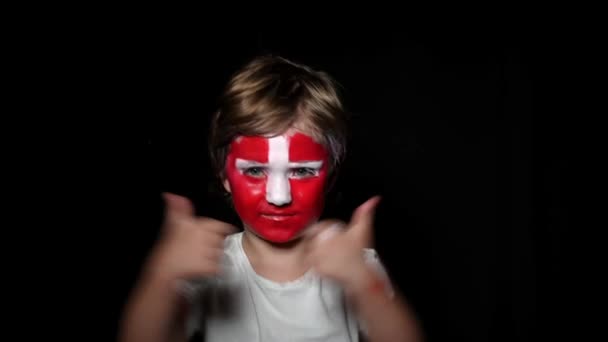 Happy fan celebrate victory of his team. Young man with face painted in national colours. Portrait of a happy man supports his national team at home — Stock Video