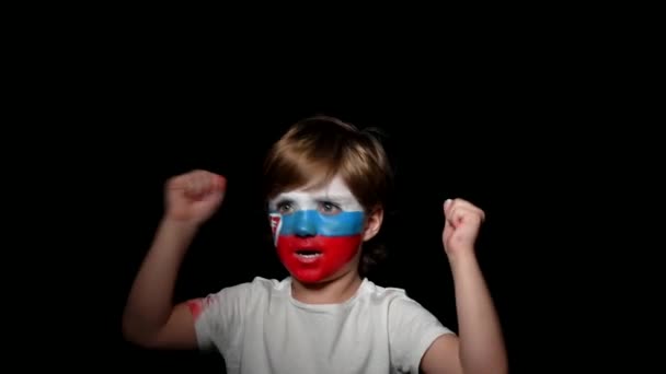 Happy fan celebrate victory of his team. Young man with face painted in national colours. Portrait of a happy man supports his national team at home — Stock Video