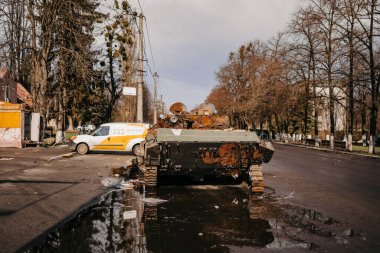 Borodyanka, Kyiv region, Ukraine. April 08, 2022: destruction and burnt out Russian military vehicle in Borodyanka clipart
