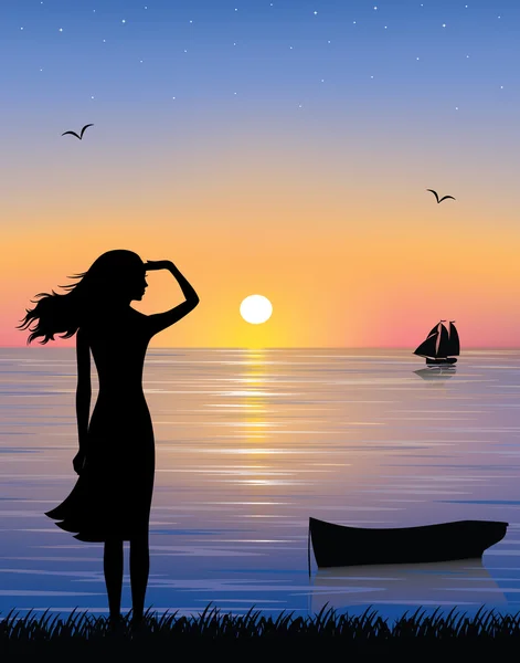 bir gemi ve gemi denizde güzel bir gün batımı ile izlerken zarif kadın silüeti.