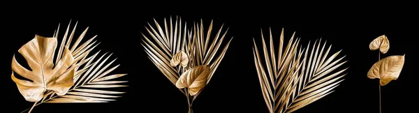 Set of golden palm leaves. Isolated on white.