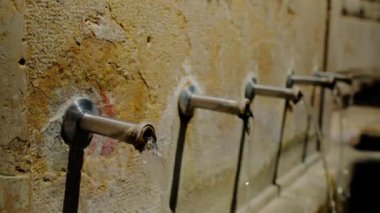 Beautiful small drinking water fountain in a slow motion. 