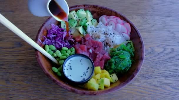 Close Bowl Poke Bowl Salad Wooden Table Sliced Fresh Vegetables — Stock Video