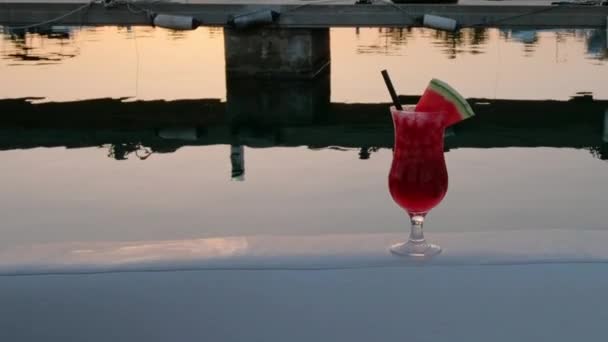 Tropical Cocktail Decorated Fresh Watermelon Seaside Sunset Harbour Boats Background — Stockvideo