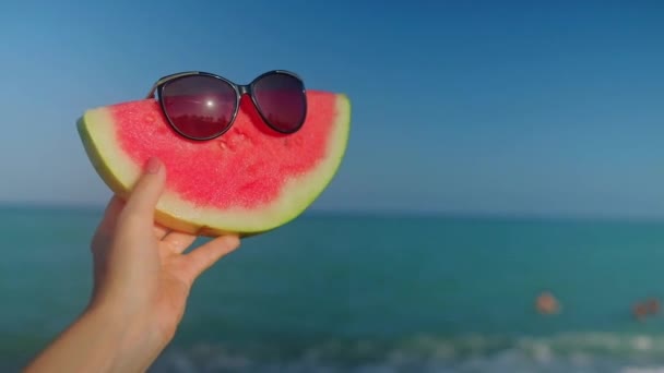 Hand Holding Watermelon Sunglasses Blue Turquoise Mediterranean Sea Waves Background — Wideo stockowe