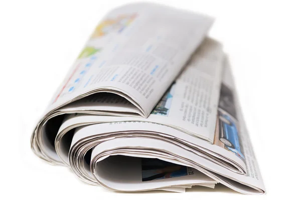 Old newspapers on a white background — Stock Photo, Image