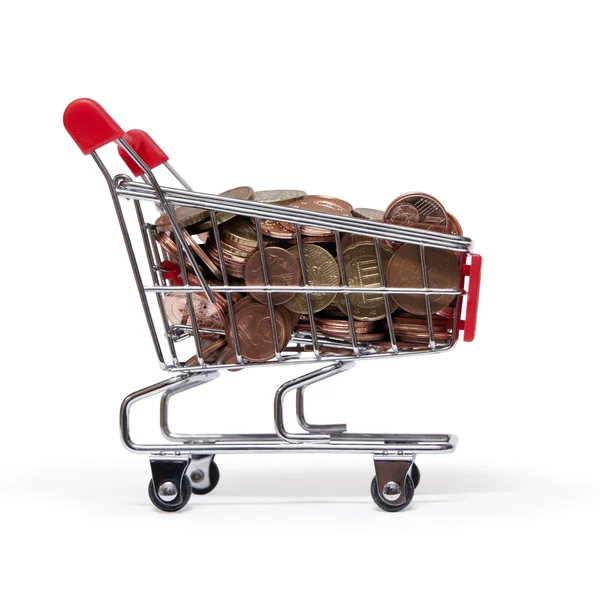 A shopping cart is filled with well-euro coins — Stock Photo, Image