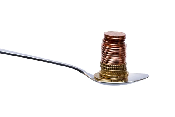 Stack of euro coins with teaspoon — Stock Photo, Image