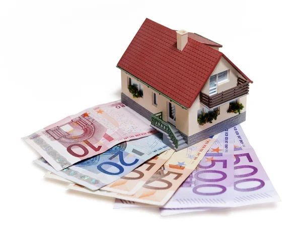 Casa con banconote in euro Foto Stock Royalty Free