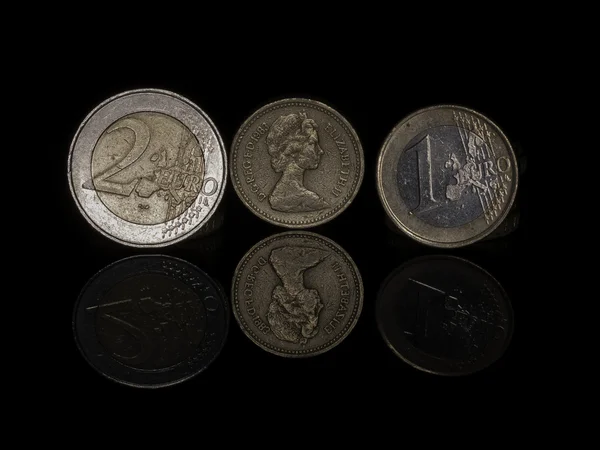 Euro and pound coins — Stock Photo, Image