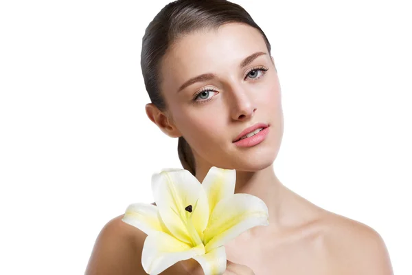 Beautiful model studio holding yellow flower — Stock Photo, Image