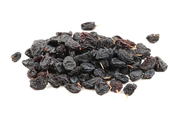 Black raisins on a white background — Stock Photo, Image