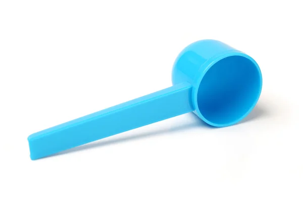 Blue plastic measuring spoon on white background — Stock Photo, Image