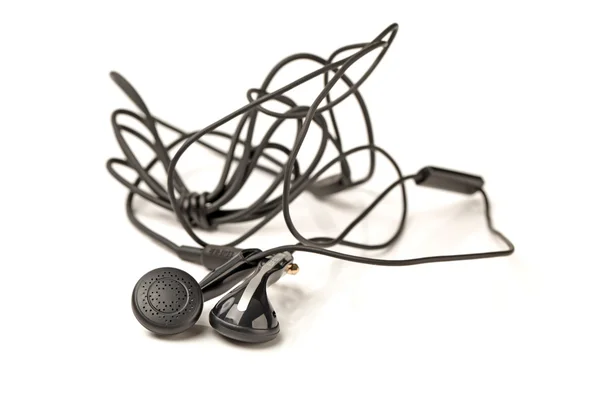 Schwarzer In-Ear-Kopfhörer isoliert auf weiß — Stockfoto