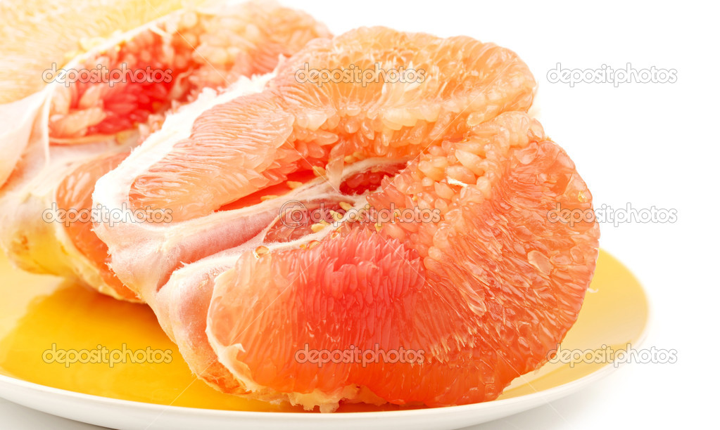Peeled pomelo pieces isolated on white background