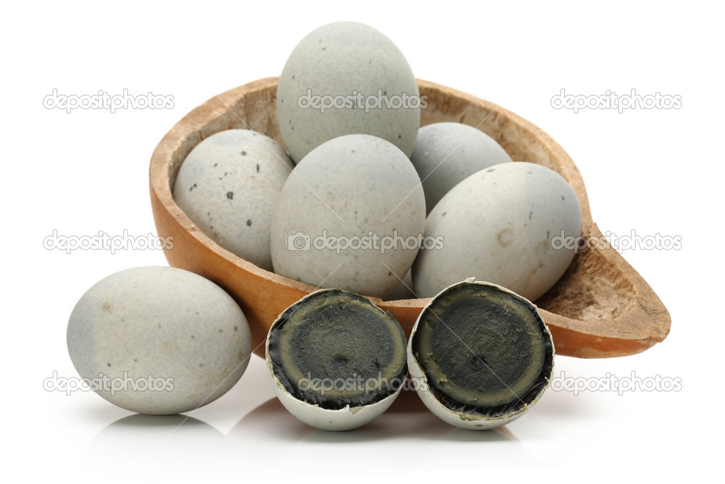 Preserved duck eggs on white background