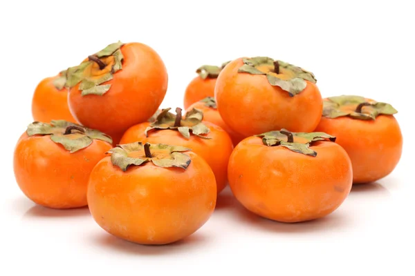 Persimmon auf weißem Hintergrund — Stockfoto