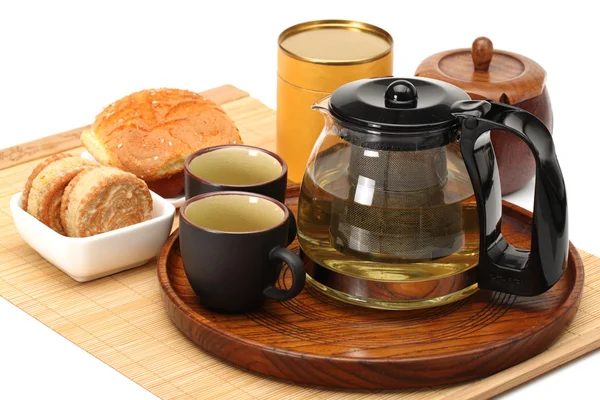 Cake,cup and teapot of tea on white background — Stock Photo, Image