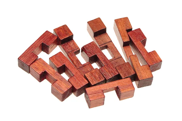 Wooden puzzle over white background — Stock Photo, Image