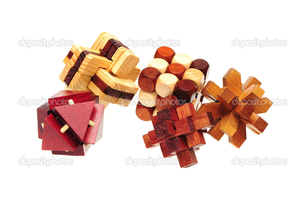 Wooden puzzle over white background