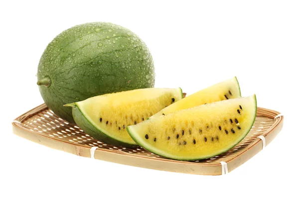 Skiva gul vattenmelon på vit bakgrund — Stockfoto