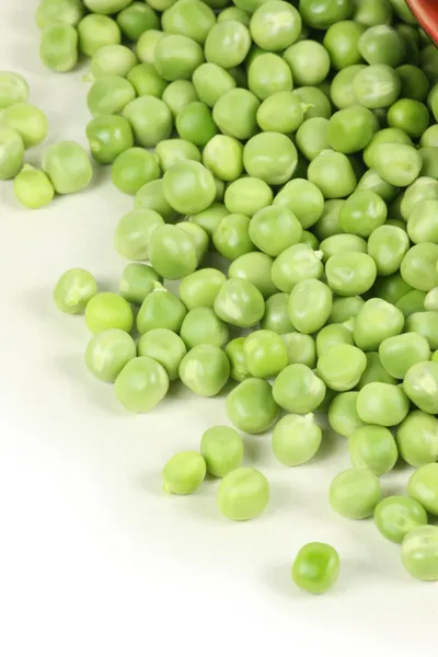 Green peas on the white background — Stock Photo, Image