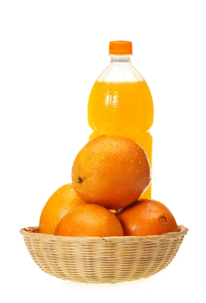 Orange fruit and bottle of juice — Stock Photo, Image