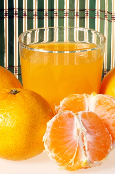 Glass of fresh tangerine juice — Stock Photo, Image