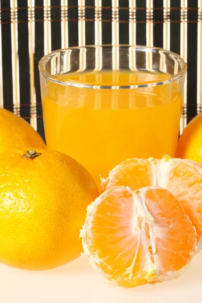 Glass of fresh tangerine juice — Stock Photo, Image