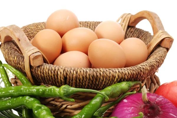 Eggs in basket , red onion ,vegetables — Stock Photo, Image