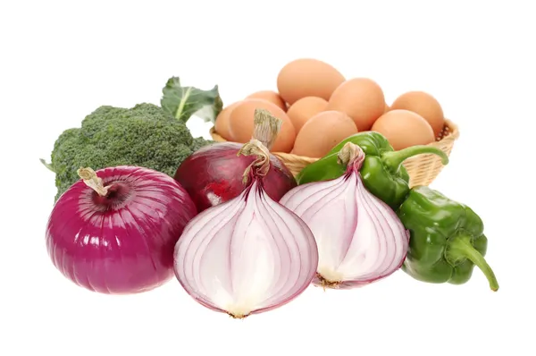 Red onion vegetables and eggs in basket — Stock Photo, Image