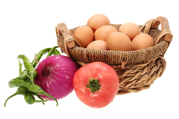 Eggs in basket , red onion ,vegetables — Stock Photo, Image