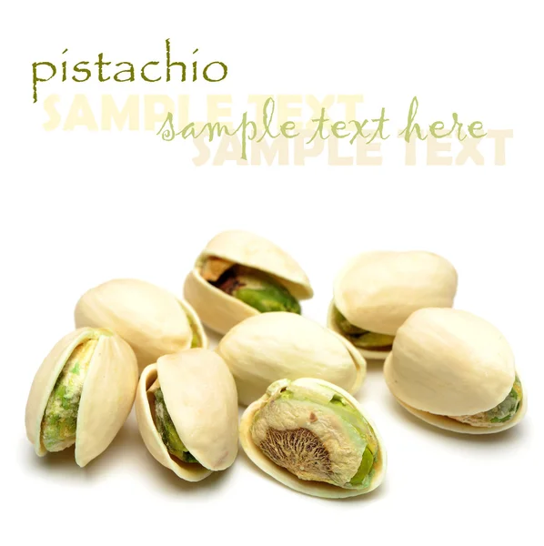 Many pistachio on white background — Stock Photo, Image