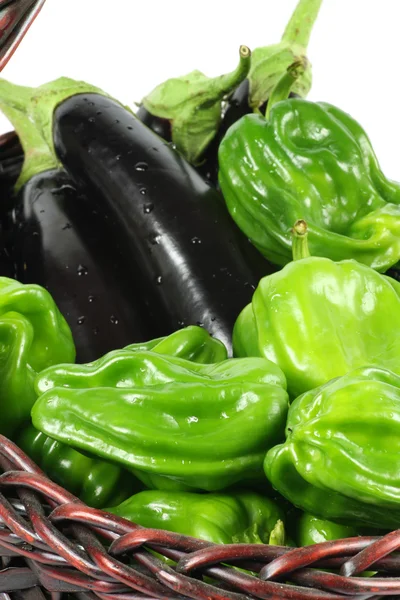 Green peppers and purple eggplant — Stock Photo, Image