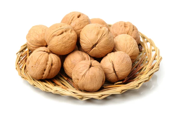 Walnuts in braided plate — Stock Photo, Image