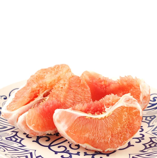 Loupaných exotickým pomelo figurky — Stock fotografie