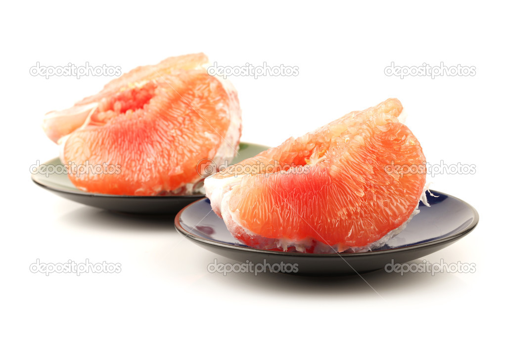 Pomelo pieces on plates